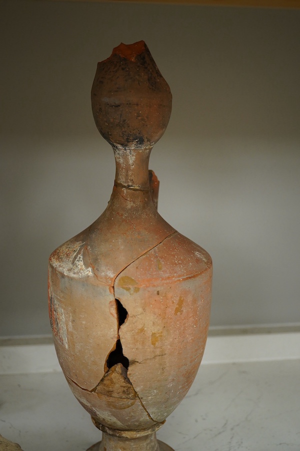 A group of antiquities- pottery and coins, including a later white glazed cup. Tallest 39cm high. Condition - fair to good considering age.